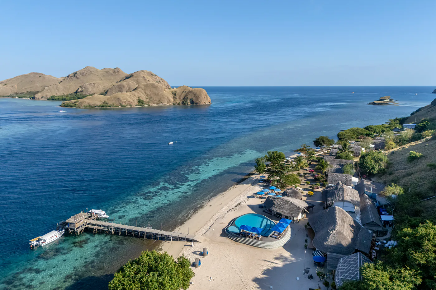 Aerial view of the Komodo Resort jetty, pool and house reef